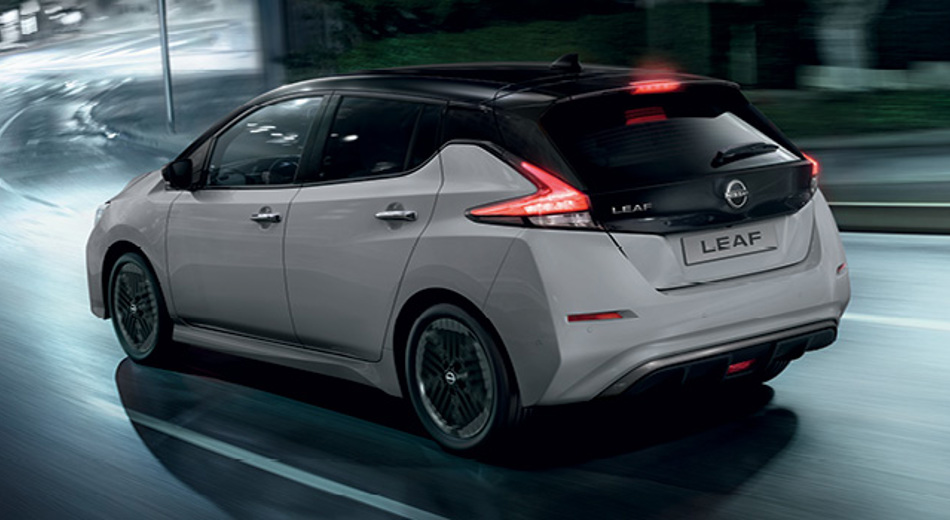 Nissan LEAF driving in town at night